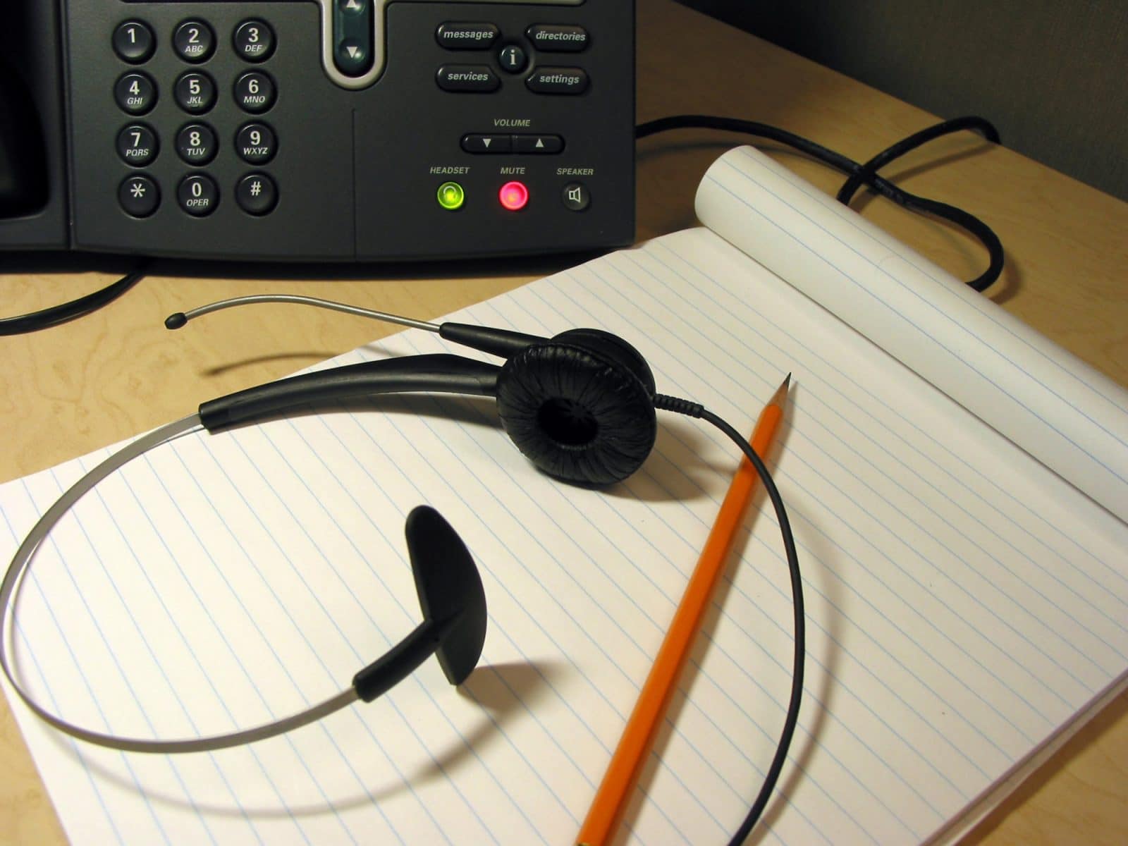 Headset and pen for call listening jobs you can do at home.